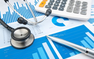 stock-photo-15063327-stethoscope-with-financial-statement-calculator-pen